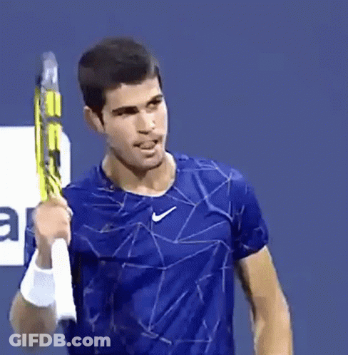 Man In Blue Nike Shirt Holding Tennis Racket GIF