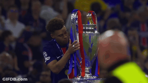 Man In Blue Nike Shirt Holding Trophy GIF