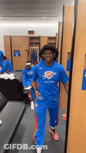 Man In Blue Oklahoma City Thunder Shirt Walking GIF
