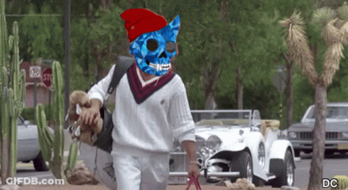 Man In Blue Pirate Mask Walking Past Stop Sign GIF