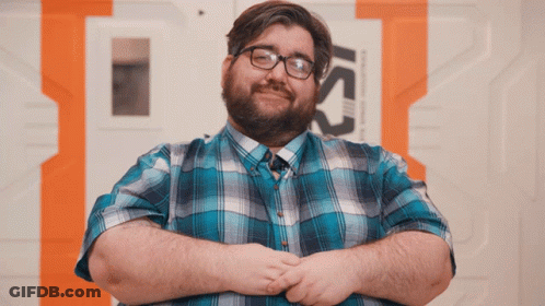Man In Blue Plaid, Glasses At Ics Sign GIF