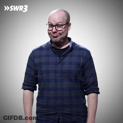 Man In Blue Plaid Shirt And Glasses By SWR3 Sign GIF
