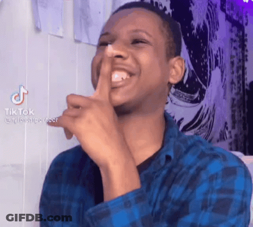 Man In Blue Plaid Shirt Laughing Shushing GIF