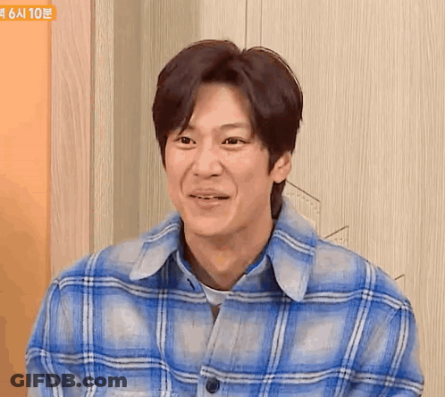 Man In Blue Plaid Shirt Smiling GIF