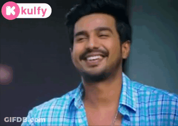 Man In Blue Plaid Shirt Smiling With Kolfy Logo GIF