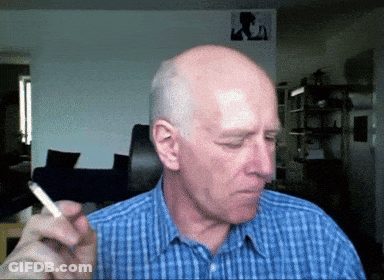 Man In Blue Plaid Shirt Smoking GIF