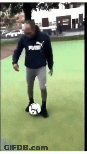 Man In Blue Puma Sweatshirt Kicking Soccer Ball GIF
