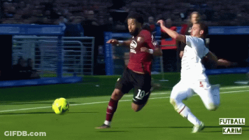 Man In Blue Puma Sweatshirt Kicking Soccer Ball GIF