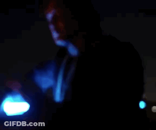 Man In Blue Robe Holding Blue Light GIF