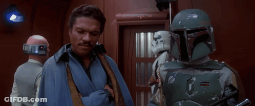 Man In Blue Robe Next To Storm Trooper GIF