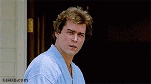 Man In Blue Robe Standing In Front Of House GIF