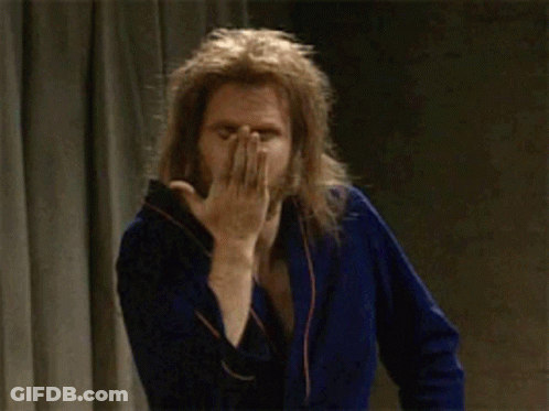 Man In Blue Robe Winking GIF