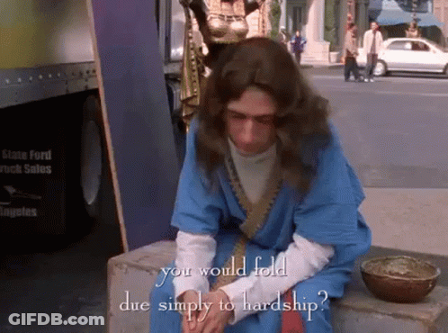 Man In Blue Robe With Text You Would Fold Due Simply To Hardship GIF