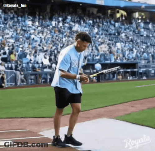 Man In Blue Royals Shirt Holding Bat GIF