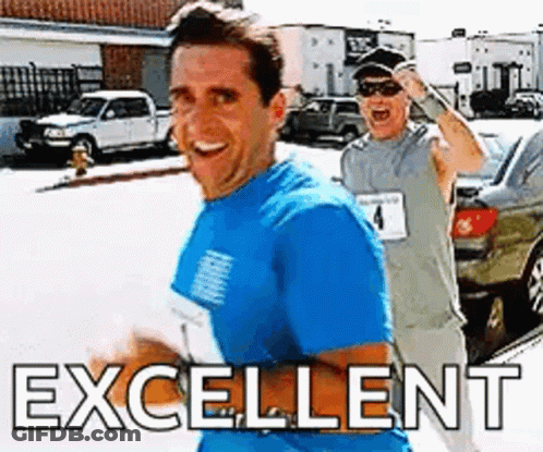 Man In Blue Running Beside Man In Grey GIF