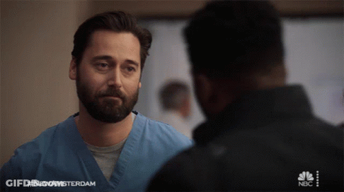 Man In Blue Scrub Talking To Another Man #NewAmsterdam GIF