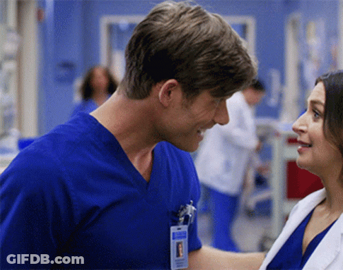 Man In Blue Scrub Top With Surgeon Name Tag GIF