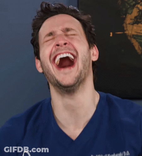 Man In Blue Scrubs Laughing GIF