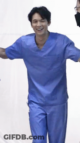 Man In Blue Scrubs Smiling GIF