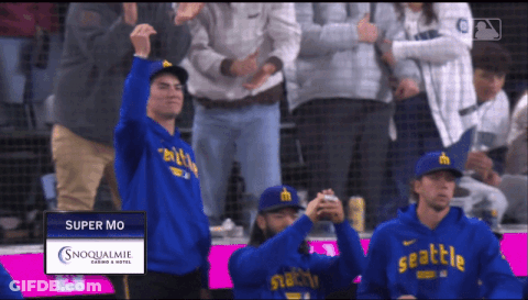 Man In Blue Seattle Hoodie In Crowd GIF