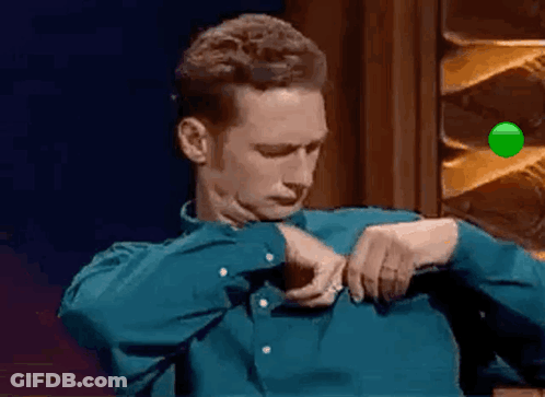 Man In Blue Shirt Adjusting Sleeves GIF