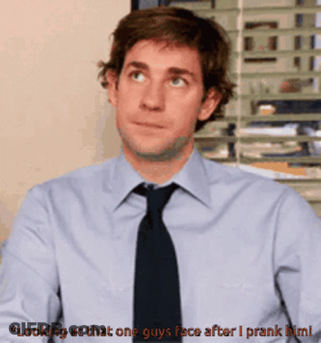 Man In Blue Shirt And Black Tie Saying Looking At That One Guy's Face After I Prank Him GIF