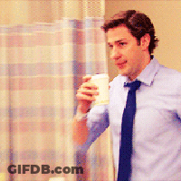 Man In Blue Shirt And Blue Tie Holding Coffee GIF
