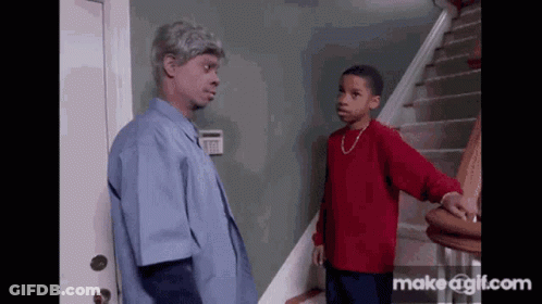 Man In Blue Shirt And Boy In Red Shirt Standing On Stairs GIF