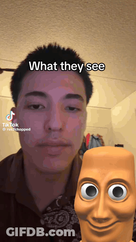 Man In Blue Shirt And Glasses Walking Down Street GIF