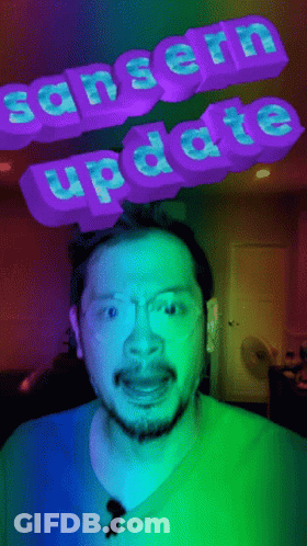 Man In Blue Shirt And Glasses With Sanserin Update Sign GIF