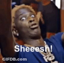 Man In Blue Shirt And Necklace Making Funny Face Saying Sheeesh GIF