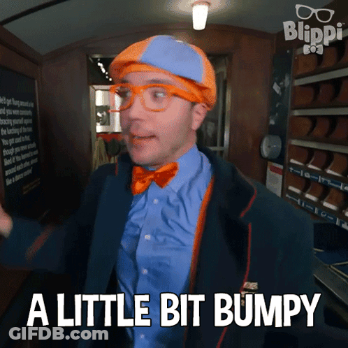 Man In Blue Shirt And Orange Bow Tie Says A Little Bit Bumpy GIF