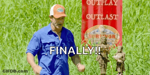 Man In Blue Shirt And Orange Hat With Red Banner Saying Outplay Outlast GIF