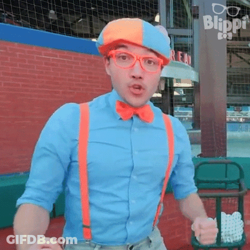 Man In Blue Shirt And Orange Suspenders In Front Of Blippi Sign GIF