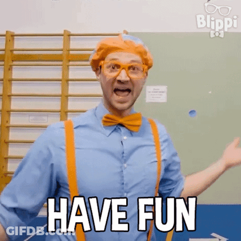 Man In Blue Shirt And Orange Suspenders Saying Have Fun GIF