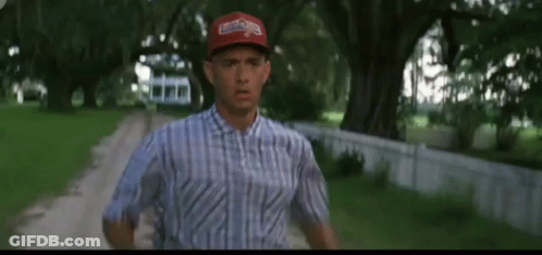 Man In Blue Shirt And Red Hat Running GIF