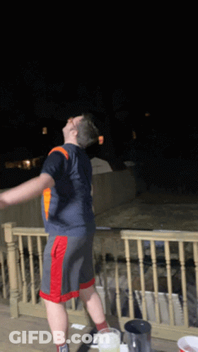 Man In Blue Shirt And Red Shorts GIF