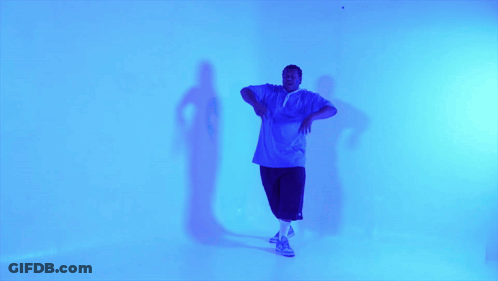 Man In Blue Shirt And Shorts Dancing GIF
