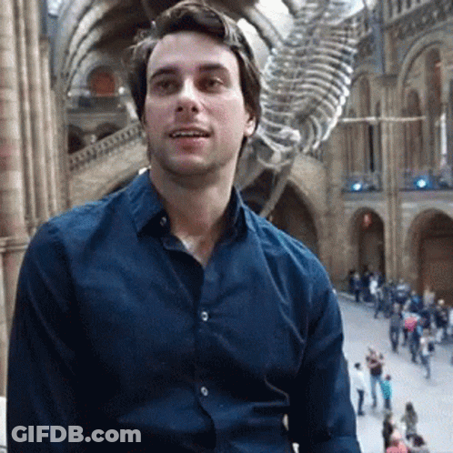 Man In Blue Shirt And Skeleton GIF