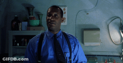 Man In Blue Shirt And Suspenders By Calendar GIF