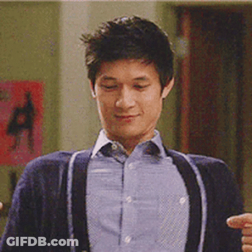Man In Blue Shirt And Suspenders Smiling GIF