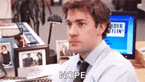 Man In Blue Shirt And Tie At Computer Saying Nope GIF