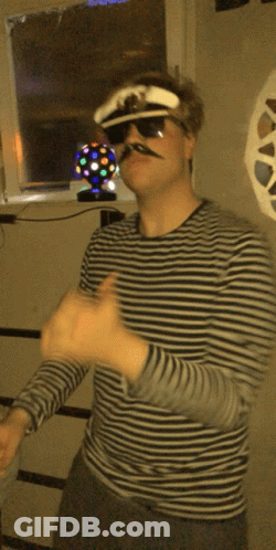 Man In Blue Shirt And Tie Eating Bagel Netflix Logo GIF