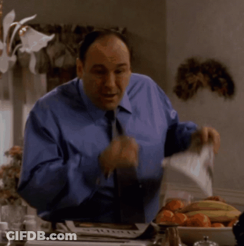 Man In Blue Shirt And Tie Holding AOL Newspaper GIF