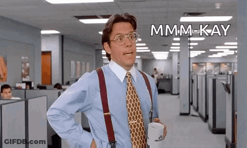 Man In Blue Shirt And Tie Holding Coffee GIF