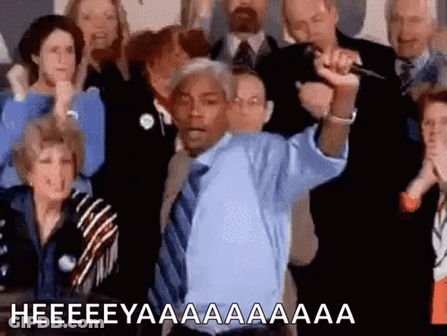 Man In Blue Shirt And Tie Holding Microphone GIF