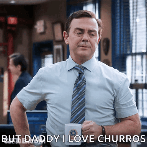 Man In Blue Shirt And Tie Holding Mug Saying Daddy I Love Churros GIF