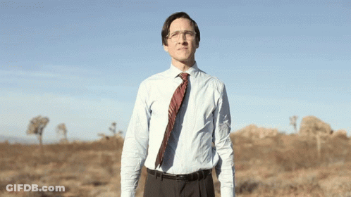 Man In Blue Shirt And Tie In Field GIF