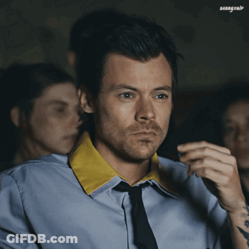 Man In Blue Shirt And Tie Looking GIF