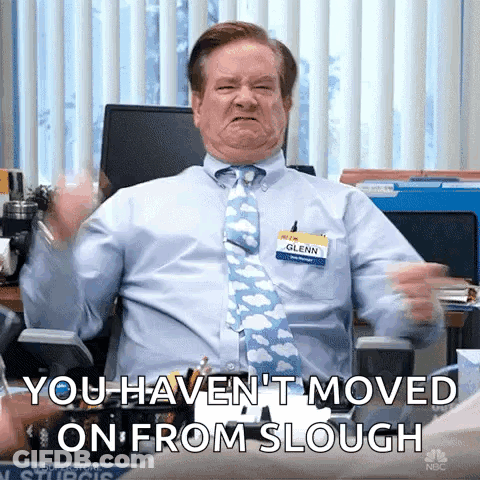 Man In Blue Shirt And Tie Making Face In Office Chair GIF